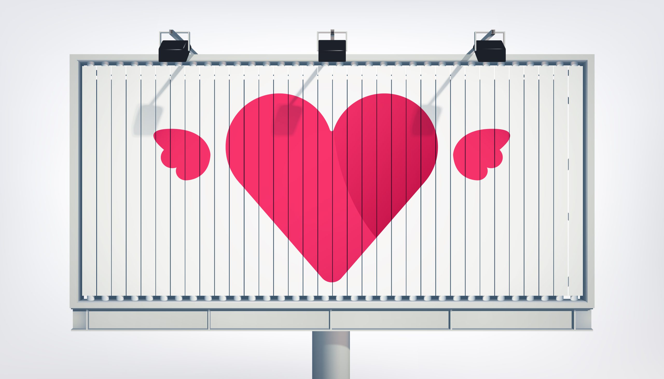 Billboard z dużym różowym sercem, stanowiący przykład ekspozycji wymagającej pozwolenie na reklamę w przestrzeni publicznej.